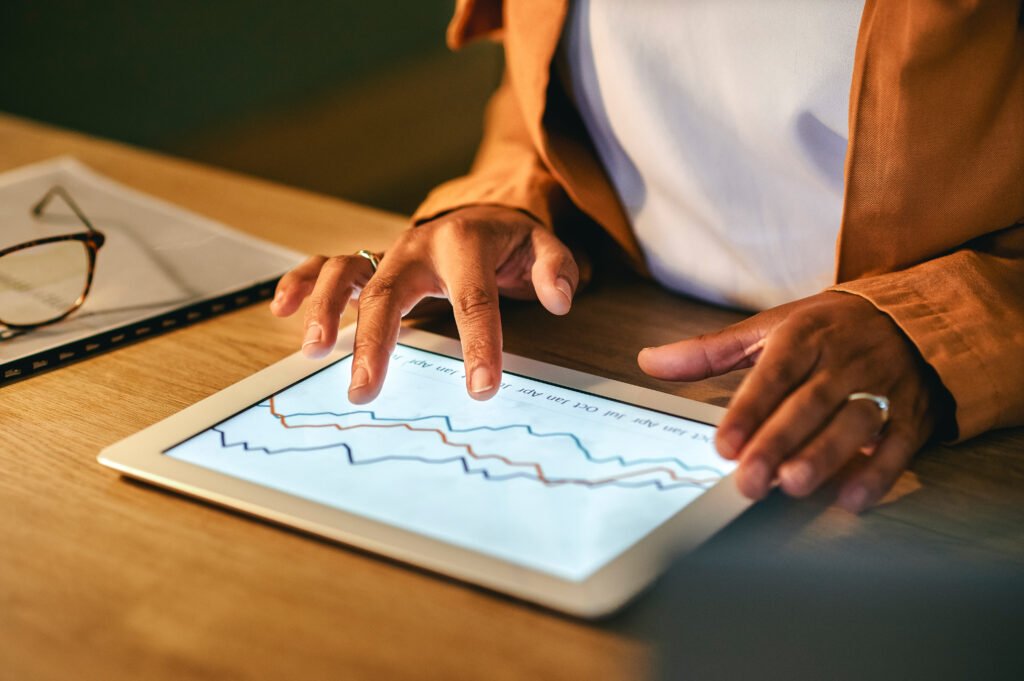 Individual reviewing investment performance as part of financial planning